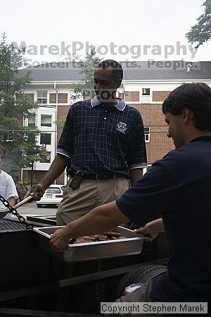 Coach Paul Hewitt and Jimmy Mitchell grill hamburgers at AXO Thursday night.  AXO was the winning sorority for the basketball attendance competition.

Filename: crw_0040_std.jpg
Aperture: f/5.6
Shutter Speed: 1/400
Body: Canon EOS DIGITAL REBEL
Lens: Sigma 15-30mm f/3.5-4.5 EX Aspherical DG DF