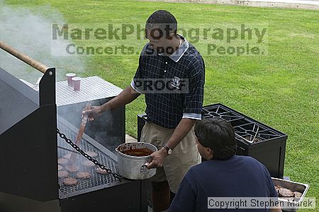 Coach Paul Hewitt and Jimmy Mitchell grill hamburgers at AXO Thursday night.  AXO was the winning sorority for the basketball attendance competition.

Filename: crw_0051_std.jpg
Aperture: f/6.3
Shutter Speed: 1/80
Body: Canon EOS DIGITAL REBEL
Lens: Canon EF 50mm f/1.8 II
