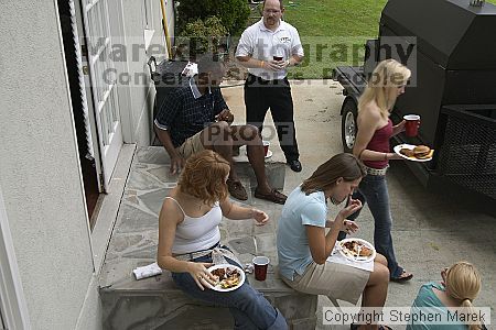 Coach Paul Hewitt grilled hamburgers at AXO Thursday night.  AXO was the winning sorority for the basketball attendance competition.

Filename: crw_0063_std.jpg
Aperture: f/7.1
Shutter Speed: 1/80
Body: Canon EOS DIGITAL REBEL
Lens: Sigma 15-30mm f/3.5-4.5 EX Aspherical DG DF
