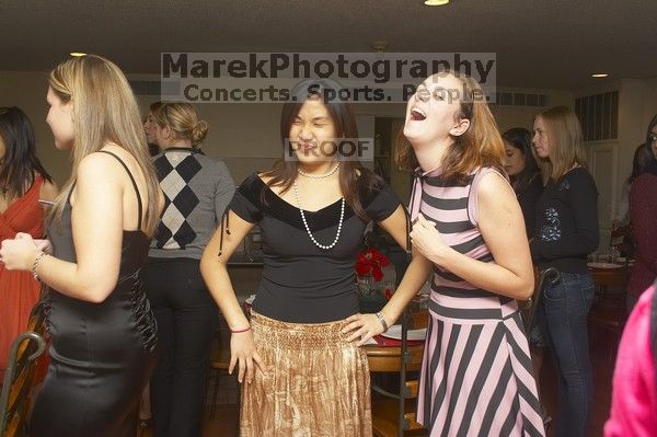 Mary Kin, left, Joy Ching, center, and Rachel Presing at the Alpha Xi Delta Christmas dinner, Friday, December 4, 2006.

Filename: SRM_20061204_1809263.jpg
Aperture: f/6.3
Shutter Speed: 1/250
Body: Canon EOS 20D
Lens: Canon EF-S 18-55mm f/3.5-5.6