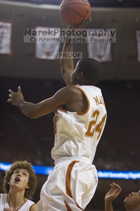 Guard Justin Mason, #24.  The longhorns defeated the Texas Southern University (TSU) Tigers 90-50 Saturday night.

Filename: SRM_20061128_1928363.jpg
Aperture: f/2.8
Shutter Speed: 1/640
Body: Canon EOS-1D Mark II
Lens: Canon EF 80-200mm f/2.8 L