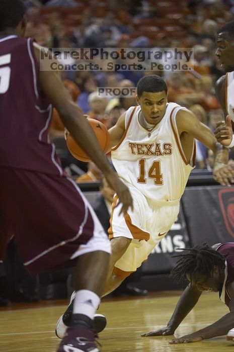 Guard D.J. Augustin, #14.  The longhorns defeated the Texas Southern University (TSU) Tigers 90-50 Tuesday night.

Filename: SRM_20061128_2013366.jpg
Aperture: f/2.8
Shutter Speed: 1/640
Body: Canon EOS-1D Mark II
Lens: Canon EF 80-200mm f/2.8 L