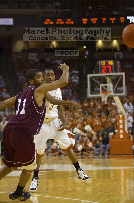 Guard A.J. Abrams, #3.  The longhorns defeated the Texas Southern University (TSU) Tigers 90-50 Tuesday night.

Filename: SRM_20061128_2020502.jpg
Aperture: f/2.8
Shutter Speed: 1/640
Body: Canon EOS-1D Mark II
Lens: Canon EF 80-200mm f/2.8 L