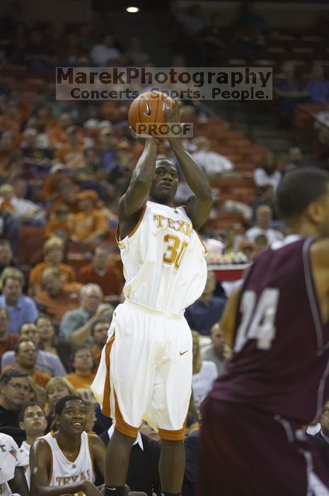 Craig Winder, #30.  The longhorns defeated the Texas Southern University (TSU) Tigers 90-50 Tuesday night.

Filename: SRM_20061128_2028023.jpg
Aperture: f/2.8
Shutter Speed: 1/640
Body: Canon EOS-1D Mark II
Lens: Canon EF 80-200mm f/2.8 L