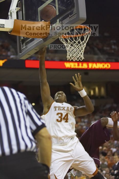 Center Dexter Pittman, #34.  The longhorns defeated the Texas Southern University (TSU) Tigers 90-50 Tuesday night.

Filename: SRM_20061128_2029524.jpg
Aperture: f/2.8
Shutter Speed: 1/640
Body: Canon EOS-1D Mark II
Lens: Canon EF 80-200mm f/2.8 L