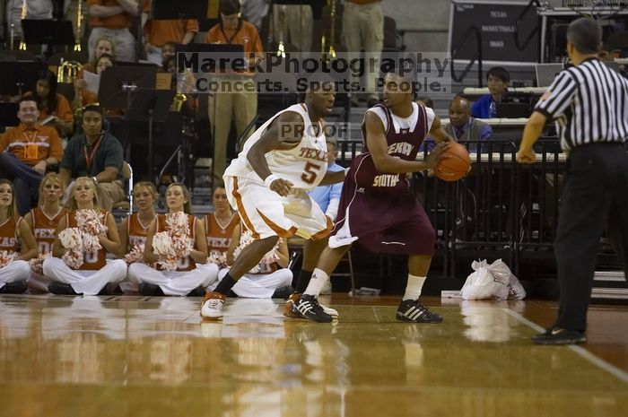 Forward Damion James, #5.  The longhorns defeated the Texas Southern University (TSU) Tigers 90-50 Tuesday night.

Filename: SRM_20061128_2037407.jpg
Aperture: f/2.8
Shutter Speed: 1/640
Body: Canon EOS-1D Mark II
Lens: Canon EF 80-200mm f/2.8 L