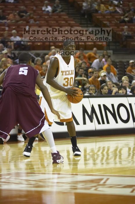 The longhorns defeated the Texas Southern University (TSU) Tigers 90-50 Tuesday night.

Filename: SRM_20061128_2039524.jpg
Aperture: f/2.8
Shutter Speed: 1/640
Body: Canon EOS-1D Mark II
Lens: Canon EF 80-200mm f/2.8 L