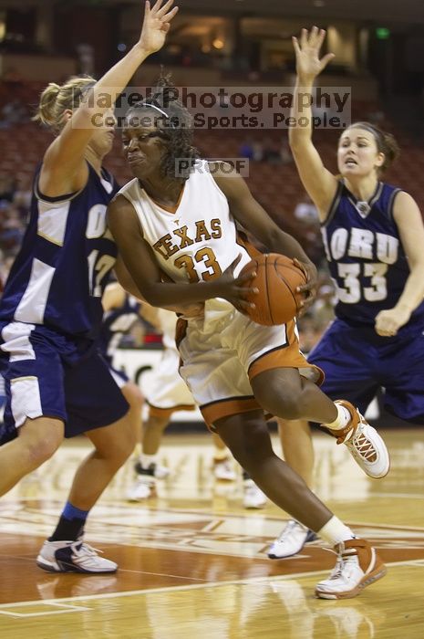 Forward Tiffany Jackson, #33.  The lady longhorns defeated the Oral Roberts University's (ORU) Golden Eagles 79-40 Saturday night.

Filename: SRM_20061125_1311189.jpg
Aperture: f/2.8
Shutter Speed: 1/400
Body: Canon EOS-1D Mark II
Lens: Canon EF 80-200mm f/2.8 L