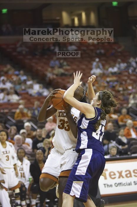 Forward Tiffany Jackson, #33.  The lady longhorns defeated the Oral Roberts University's (ORU) Golden Eagles 79-40 Saturday night.

Filename: SRM_20061125_1329088.jpg
Aperture: f/2.8
Shutter Speed: 1/400
Body: Canon EOS-1D Mark II
Lens: Canon EF 80-200mm f/2.8 L