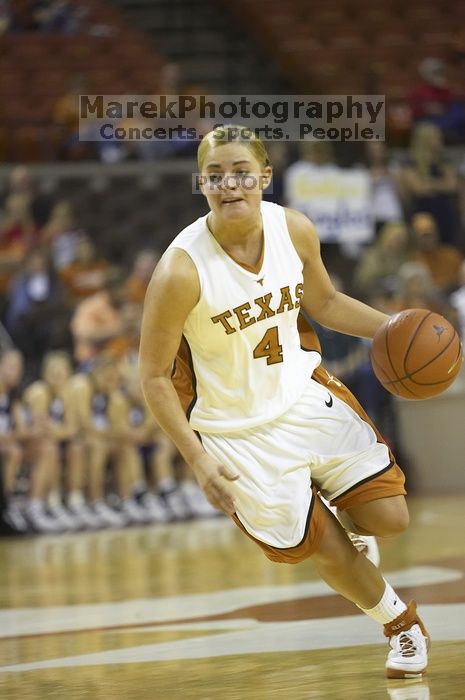 Guard Erika Arriaran, #4.  The lady longhorns defeated the Oral Roberts University's (ORU) Golden Eagles 79-40 Saturday night.

Filename: SRM_20061125_1333048.jpg
Aperture: f/2.8
Shutter Speed: 1/400
Body: Canon EOS-1D Mark II
Lens: Canon EF 80-200mm f/2.8 L