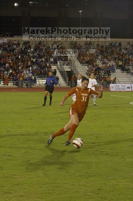 Amy Burlingham, #31.  The lady longhorns beat Texas A&M 1-0 in soccer Friday night.

Filename: SRM_20061027_2037209.jpg
Aperture: f/4.0
Shutter Speed: 1/800
Body: Canon EOS 20D
Lens: Canon EF 80-200mm f/2.8 L