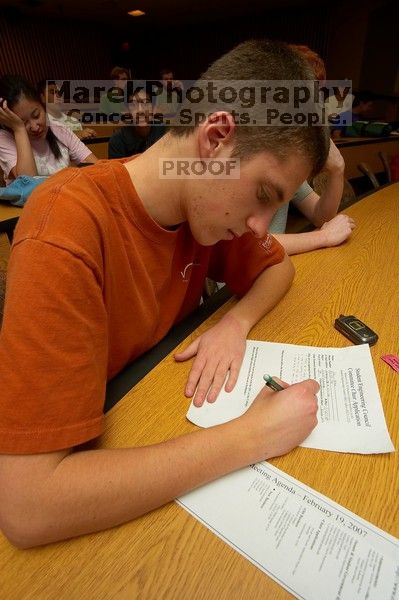 Sagi Zisman filling out an application at the Engineering Council meeting, Monday, February 19, 2007.

Filename: SRM_20070219_1904446.jpg
Aperture: f/8.0
Shutter Speed: 1/100
Body: Canon EOS-1D Mark II
Lens: Sigma 15-30mm f/3.5-4.5 EX Aspherical DG DF