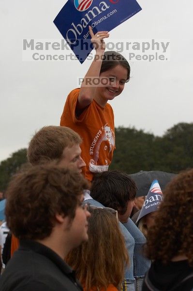 Annie Billups, held up by Jon Strahl, dances to the music of before Obama spoke.  The Barack Obama "Kick-Ass" Rally--the Obama for president, 2008, rally.

Filename: SRM_20070223_1420003.jpg
Aperture: f/5.6
Shutter Speed: 1/400
Body: Canon EOS 20D
Lens: Canon EF 80-200mm f/2.8 L