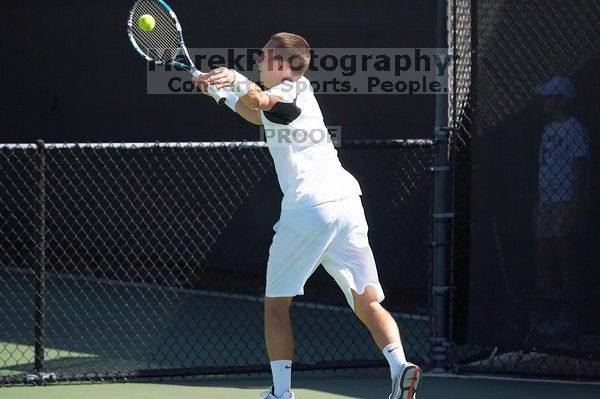 Texas' Dimitar Kutrovsky defeated Tech's Jose Muguruza 6-2 and 6-3.  The University of Texas (UT) men's tennis team defeated Georgia Tech (GT) Saturday, February 24, 2007..

Filename: SRM_20070224_1418365.jpg
Aperture: f/4.0
Shutter Speed: 1/3200
Body: Canon EOS-1D Mark II
Lens: Canon EF 80-200mm f/2.8 L