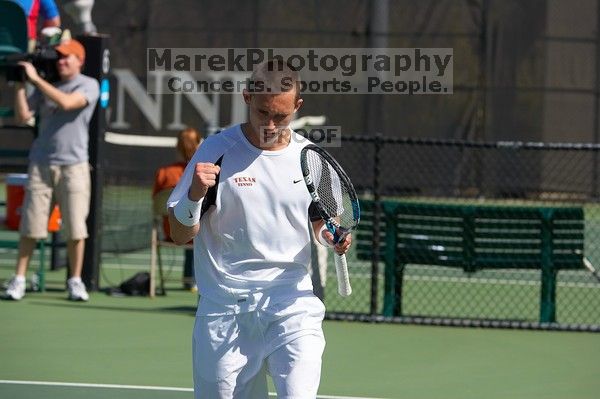 Texas' Dimitar Kutrovsky defeated Tech's Jose Muguruza 6-2 and 6-3.  The University of Texas (UT) men's tennis team defeated Georgia Tech (GT) Saturday, February 24, 2007..

Filename: SRM_20070224_1422161.jpg
Aperture: f/4.5
Shutter Speed: 1/4000
Body: Canon EOS-1D Mark II
Lens: Canon EF 80-200mm f/2.8 L