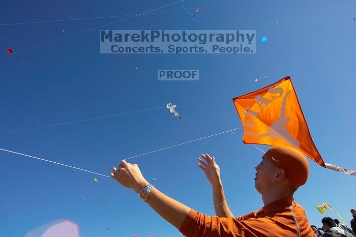 Chris Lam attempts to fly his UT kite at the 79th annual Zilker Park Kite Festival, Sunday, March 4, 2007.

Filename: SRM_20070304_1531585.jpg
Aperture: f/11.0
Shutter Speed: 1/250
Body: Canon EOS-1D Mark II
Lens: Sigma 15-30mm f/3.5-4.5 EX Aspherical DG DF