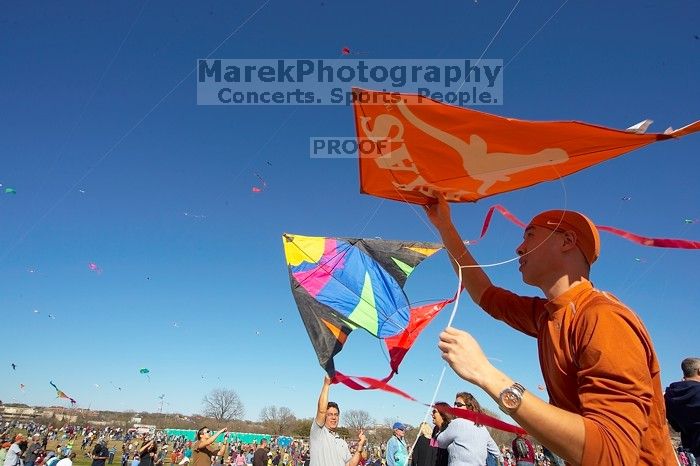 Chris Lam attempts to fly his UT kite at the 79th annual Zilker Park Kite Festival, Sunday, March 4, 2007.

Filename: SRM_20070304_1532081.jpg
Aperture: f/11.0
Shutter Speed: 1/250
Body: Canon EOS-1D Mark II
Lens: Sigma 15-30mm f/3.5-4.5 EX Aspherical DG DF