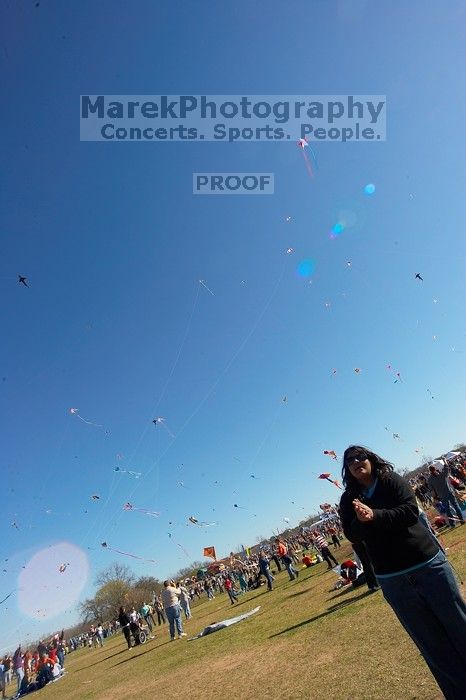 Madhav Tadikonda, class of 1997, and Anjali Patel, class of 1999, fly a UT kite at the 79th annual Zilker Park Kite Festival, Sunday, March 4, 2007.

Filename: SRM_20070304_1538025.jpg
Aperture: f/11.0
Shutter Speed: 1/250
Body: Canon EOS-1D Mark II
Lens: Sigma 15-30mm f/3.5-4.5 EX Aspherical DG DF