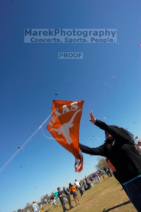 Madhav Tadikonda, class of 1997, and Anjali Patel, class of 1999, fly a UT kite at the 79th annual Zilker Park Kite Festival, Sunday, March 4, 2007.

Filename: SRM_20070304_1538186.jpg
Aperture: f/11.0
Shutter Speed: 1/250
Body: Canon EOS-1D Mark II
Lens: Sigma 15-30mm f/3.5-4.5 EX Aspherical DG DF