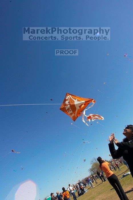 Madhav Tadikonda, class of 1997, and Anjali Patel, class of 1999, fly a UT kite at the 79th annual Zilker Park Kite Festival, Sunday, March 4, 2007.

Filename: SRM_20070304_1538241.jpg
Aperture: f/11.0
Shutter Speed: 1/250
Body: Canon EOS-1D Mark II
Lens: Sigma 15-30mm f/3.5-4.5 EX Aspherical DG DF
