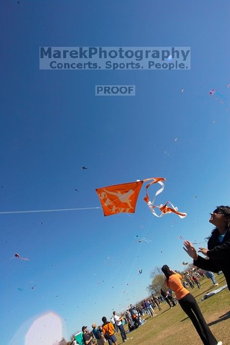 Madhav Tadikonda, class of 1997, and Anjali Patel, class of 1999, fly a UT kite at the 79th annual Zilker Park Kite Festival, Sunday, March 4, 2007.

Filename: SRM_20070304_1538262.jpg
Aperture: f/11.0
Shutter Speed: 1/250
Body: Canon EOS-1D Mark II
Lens: Sigma 15-30mm f/3.5-4.5 EX Aspherical DG DF