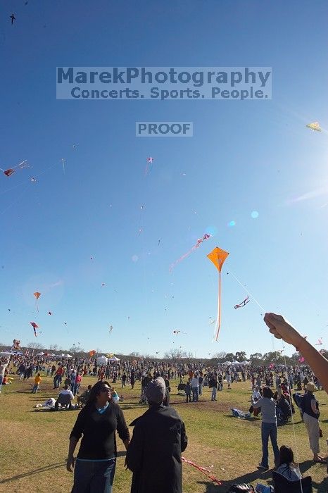 Madhav Tadikonda, class of 1997, and Anjali Patel, class of 1999, fly a UT kite at the 79th annual Zilker Park Kite Festival, Sunday, March 4, 2007.

Filename: SRM_20070304_1540443.jpg
Aperture: f/11.0
Shutter Speed: 1/250
Body: Canon EOS-1D Mark II
Lens: Sigma 15-30mm f/3.5-4.5 EX Aspherical DG DF
