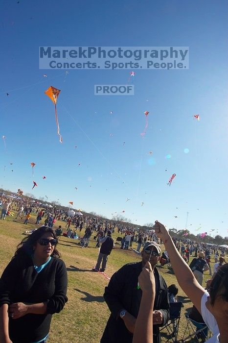 Madhav Tadikonda, class of 1997, and Anjali Patel, class of 1999, fly a UT kite at the 79th annual Zilker Park Kite Festival, Sunday, March 4, 2007.

Filename: SRM_20070304_1540466.jpg
Aperture: f/11.0
Shutter Speed: 1/250
Body: Canon EOS-1D Mark II
Lens: Sigma 15-30mm f/3.5-4.5 EX Aspherical DG DF