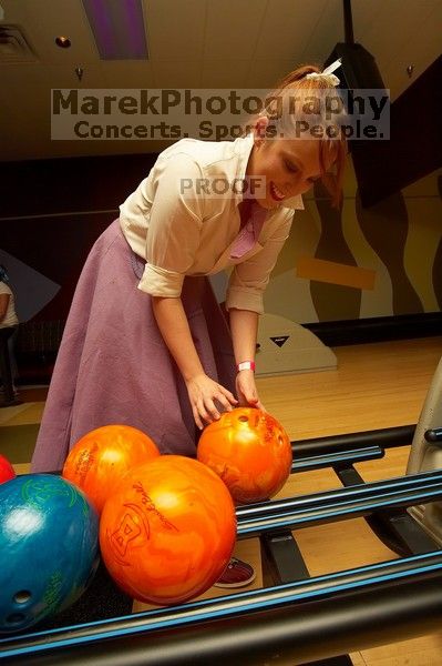 Amanda Young reaching for a bowling ball.  Alpha Xi Delta held a sock hop themed date night at the Austin 300 bowling alley, Thursday night, March 29, 2007.

Filename: SRM_20070329_2024224.jpg
Aperture: f/8.0
Shutter Speed: 1/200
Body: Canon EOS-1D Mark II
Lens: Sigma 15-30mm f/3.5-4.5 EX Aspherical DG DF