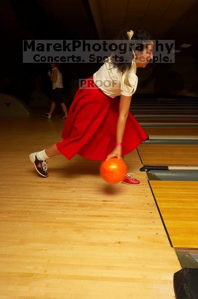 Sabrina Garza bowling.  Alpha Xi Delta held a sock hop themed date night at the Austin 300 bowling alley, Thursday night, March 29, 2007.

Filename: SRM_20070329_2031549.jpg
Aperture: f/8.0
Shutter Speed: 1/200
Body: Canon EOS-1D Mark II
Lens: Sigma 15-30mm f/3.5-4.5 EX Aspherical DG DF