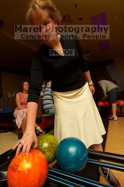 Heidi Frank reaching for a bowling ball.  Alpha Xi Delta held a sock hop themed date night at the Austin 300 bowling alley, Thursday night, March 29, 2007.

Filename: SRM_20070329_2100480.jpg
Aperture: f/8.0
Shutter Speed: 1/200
Body: Canon EOS-1D Mark II
Lens: Sigma 15-30mm f/3.5-4.5 EX Aspherical DG DF