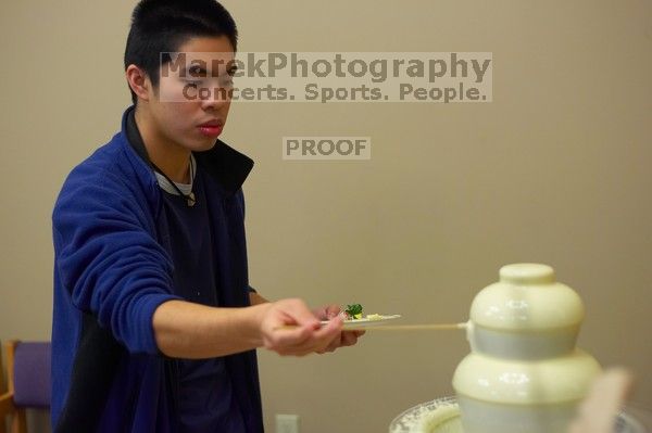 The Asian Business Students Association (ABSA) hosted a chocolate fondue Friday, January 26, 2007 before heading off to a movie premier.

Filename: SRM_20070126_1638365.jpg
Aperture: f/2.2
Shutter Speed: 1/50
Body: Canon EOS-1D Mark II
Lens: Canon EF 50mm f/1.8 II