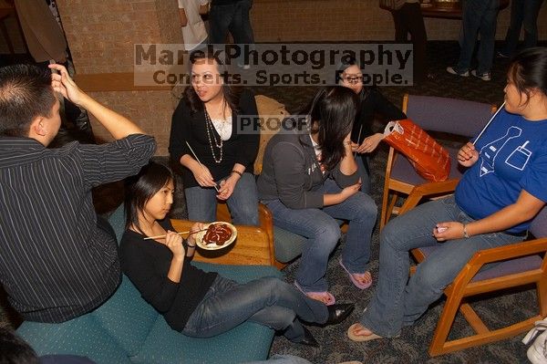 The Asian Business Students Association (ABSA) hosted a chocolate fondue Friday, January 26, 2007 before heading off to a movie premier.

Filename: SRM_20070126_1648524.jpg
Aperture: f/5.6
Shutter Speed: 1/160
Body: Canon EOS 20D
Lens: Canon EF-S 18-55mm f/3.5-5.6