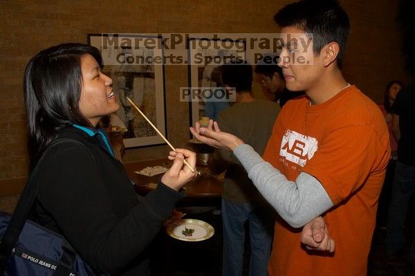 Tina Chien and Eric Chang.  The Asian Business Students Association (ABSA) hosted a chocolate fondue Friday, January 26, 2007 before heading off to a movie premier.

Filename: SRM_20070126_1657228.jpg
Aperture: f/5.6
Shutter Speed: 1/160
Body: Canon EOS 20D
Lens: Canon EF-S 18-55mm f/3.5-5.6