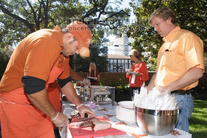 Joyce Pickens and her parents grab some brisket at the KKG BBQ.  Kappa Kappa Gamma hosted a parents' weekend barbecue before the UT vs Nebraska football game on Saturday, October 27, 2007 at their sorority house.

Filename: SRM_20071027_1138220.jpg
Aperture: f/8.0
Shutter Speed: 1/250
Body: Canon EOS 20D
Lens: Canon EF-S 18-55mm f/3.5-5.6