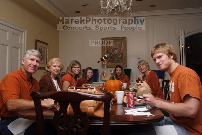 Rachel Upshaw and her family, left, and Keaton Benn, center left, and her mother, back right.  Kappa Kappa Gamma (KKG) hosted a parents' weekend barbecue before the UT vs Nebraska football game on Saturday, October 27, 2007 at their sorority house.

Filename: SRM_20071027_1148062.jpg
Aperture: f/8.0
Shutter Speed: 1/250
Body: Canon EOS 20D
Lens: Canon EF-S 18-55mm f/3.5-5.6