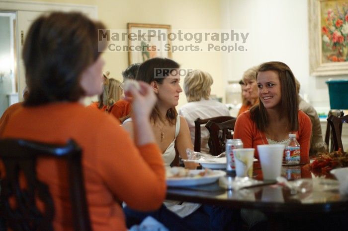 Hannah Koeijmans (in white), Madeline Koeijmans (in red), Grace Koeijmans (in brown and orange) and their parents.  Kappa Kappa Gamma (KKG) hosted a parents' weekend barbecue before the UT vs Nebraska football game on Saturday, October 27, 2007 at their so

Filename: SRM_20071027_1150328.jpg
Aperture: f/1.8
Shutter Speed: 1/60
Body: Canon EOS-1D Mark II
Lens: Canon EF 50mm f/1.8 II
