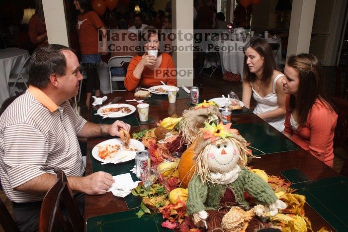 Hannah Koeijmans (in white), Madeline Koeijmans (in red), Grace Koeijmans (in brown and orange) and their parents.  Kappa Kappa Gamma (KKG) hosted a parents' weekend barbecue before the UT vs Nebraska football game on Saturday, October 27, 2007 at their so

Filename: SRM_20071027_1151263.jpg
Aperture: f/8.0
Shutter Speed: 1/250
Body: Canon EOS 20D
Lens: Canon EF-S 18-55mm f/3.5-5.6