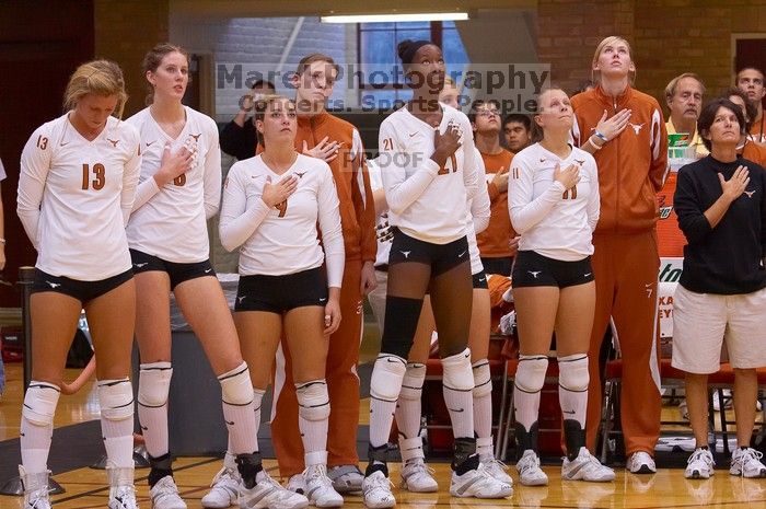 UT senior Jen Christian (#13, OH), UT freshman Jennifer Doris (#8, UTIL), UT freshman Chelsey Klein (#9, DS), UT sophomore Destinee Hooker (#21, OH), and UT junior Kiley Hall (#11, DS/L) pause for the national anthem before the game.  The Longhorns defeate

Filename: SRM_20071024_1832449.jpg
Aperture: f/5.0
Shutter Speed: 1/200
Body: Canon EOS-1D Mark II
Lens: Canon EF 80-200mm f/2.8 L