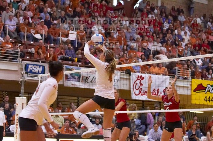 UT senior Michelle Moriarty (#4, S) sets the ball as UT senior Brandy Magee (#44, MB), Nebraska sophomore Kori Cooper (#15, MB), and Nebraska senior Sarah Pavan (#9, RS) watch.  The Longhorns defeated the Huskers 3-0 on Wednesday night, October 24, 2007 at

Filename: SRM_20071024_1845269.jpg
Aperture: f/4.0
Shutter Speed: 1/400
Body: Canon EOS-1D Mark II
Lens: Canon EF 80-200mm f/2.8 L