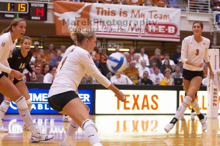 UT sophomore Heather Kisner (#19, DS) hits the ball as UT sophomore Ashley Engle (#10, S/RS), UT senior Alyson Jennings (#16, L), and UT junior Lauren Paolini (#3, UTIL) watch.  The Longhorns defeated the Huskers 3-0 on Wednesday night, October 24, 2007 at

Filename: SRM_20071024_1851385.jpg
Aperture: f/4.0
Shutter Speed: 1/400
Body: Canon EOS-1D Mark II
Lens: Canon EF 80-200mm f/2.8 L
