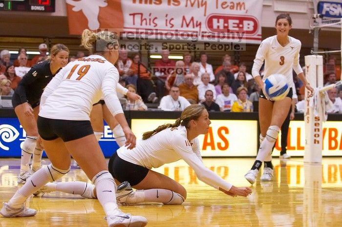 UT sophomore Ashley Engle (#10, S/RS) hits the ball as UT senior Alyson Jennings (#16, L), UT sophomore Heather Kisner (#19, DS), and UT junior Lauren Paolini (#3, UTIL) watch.  The Longhorns defeated the Huskers 3-0 on Wednesday night, October 24, 2007 at

Filename: SRM_20071024_1852061.jpg
Aperture: f/4.0
Shutter Speed: 1/400
Body: Canon EOS-1D Mark II
Lens: Canon EF 80-200mm f/2.8 L