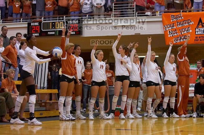 UT sophomore Destinee Hooker (#21, OH) serves the ball as teammates UT senior Brandy Magee (#44, MB), UT sophomore Heather Kisner (#19, DS), UT freshman Jennifer Doris (#8, UTIL), UT freshman Chelsey Klein (#9, DS), UT freshman Alexandra Lewis (#12, DS) an

Filename: SRM_20071024_1903167.jpg
Aperture: f/4.0
Shutter Speed: 1/400
Body: Canon EOS-1D Mark II
Lens: Canon EF 80-200mm f/2.8 L