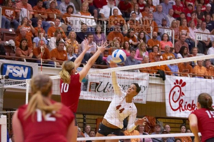 UT senior Brandy Magee (#44, MB) spikes past Nebraska junior Jordan Larson (#10, OH) as Nebraska sophomore Rachel Holloway (#12, S) and Nebraska sophomore Kori Cooper (#15, MB) wait.  The Longhorns defeated the Huskers 3-0 on Wednesday night, October 24, 2

Filename: SRM_20071024_1917321.jpg
Aperture: f/3.5
Shutter Speed: 1/400
Body: Canon EOS-1D Mark II
Lens: Canon EF 80-200mm f/2.8 L