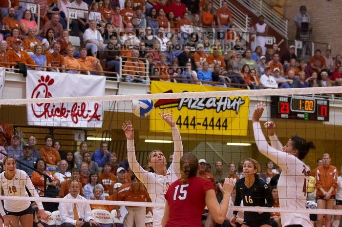 UT senior Michelle Moriarty (#4, S) sets the ball for UT sophomore Ashley Engle (#10, S/RS) as UT senior Alyson Jennings (#16, L), UT senior Brandy Magee (#44, MB) and Nebraska sophomore Kori Cooper (#15, MB) watch.  The Longhorns defeated the Huskers 3-0

Filename: SRM_20071024_1928102.jpg
Aperture: f/4.0
Shutter Speed: 1/400
Body: Canon EOS-1D Mark II
Lens: Canon EF 80-200mm f/2.8 L