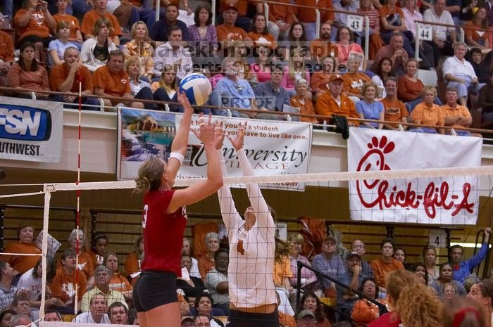 UT senior Michelle Moriarty (#4, S) blocks a hit by Nebraska senior Christina Houghtelling (#3, OH).  The Longhorns defeated the Huskers 3-0 on Wednesday night, October 24, 2007 at Gregory Gym.

Filename: SRM_20071024_1932440.jpg
Aperture: f/4.0
Shutter Speed: 1/400
Body: Canon EOS-1D Mark II
Lens: Canon EF 80-200mm f/2.8 L