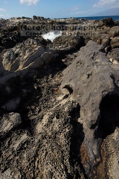 Hike to the Nakalele blowholes along the surf-beaten lava formations.

Filename: SRM_20071219_1228301.jpg
Aperture: f/8.0
Shutter Speed: 1/2500
Body: Canon EOS-1D Mark II
Lens: Sigma 15-30mm f/3.5-4.5 EX Aspherical DG DF