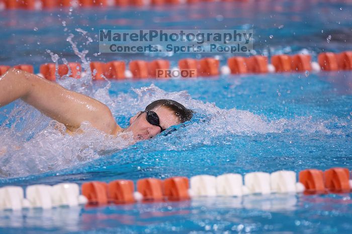 UT junior Michael Klueh won the 1000 yard freestyle with a time of 9:01.89.  The University of Texas Longhorns defeated The University of Georgia Bulldogs 157-135 on Saturday, January 12, 2008.

Filename: SRM_20080112_1107589.jpg
Aperture: f/2.8
Shutter Speed: 1/400
Body: Canon EOS-1D Mark II
Lens: Canon EF 300mm f/2.8 L IS