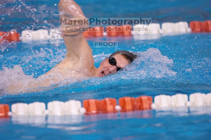 UT junior Michael Klueh won the 1000 yard freestyle with a time of 9:01.89.  The University of Texas Longhorns defeated The University of Georgia Bulldogs 157-135 on Saturday, January 12, 2008.

Filename: SRM_20080112_1108263.jpg
Aperture: f/2.8
Shutter Speed: 1/400
Body: Canon EOS-1D Mark II
Lens: Canon EF 300mm f/2.8 L IS