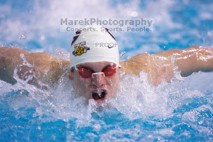 Georgia's Mark Dylla took third in the 200 yard butterfly with a time of 1:49.61.  The University of Texas Longhorns defeated The University of Georgia Bulldogs 157-135 on Saturday, January 12, 2008.

Filename: SRM_20080112_1126521.jpg
Aperture: f/2.8
Shutter Speed: 1/400
Body: Canon EOS-1D Mark II
Lens: Canon EF 300mm f/2.8 L IS