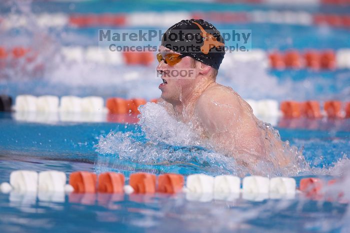 UT senior Matthew Lowe took first in the 200 yard breaststroke with a time of 2:01.46.  The University of Texas Longhorns defeated The University of Georgia Bulldogs 157-135 on Saturday, January 12, 2008.

Filename: SRM_20080112_1200325.jpg
Aperture: f/2.8
Shutter Speed: 1/400
Body: Canon EOS-1D Mark II
Lens: Canon EF 300mm f/2.8 L IS